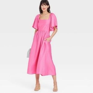Pink flutter sleeve tie back dress